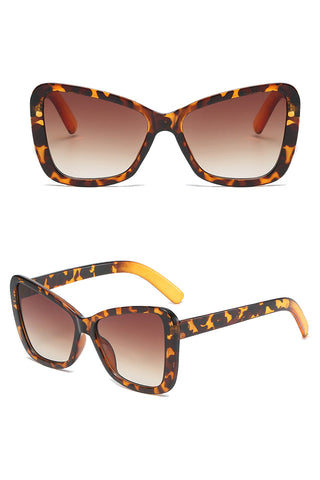 All eyes on you with this beautiful Atomic Leopard Butterfly Retro Sunglasses. This pair of sunglasses features retro-inspired big square frames, gradient lens, and it's light on the nose.