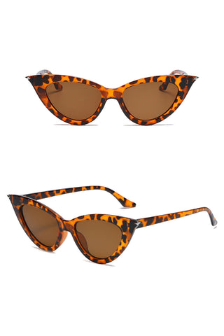 Stay shady with our Atomic Leopard Pointed Cat Eye Sunglasses. This pair of sunglasses features a pointed cat eye frame, gradient lens, and it's light on the nose.