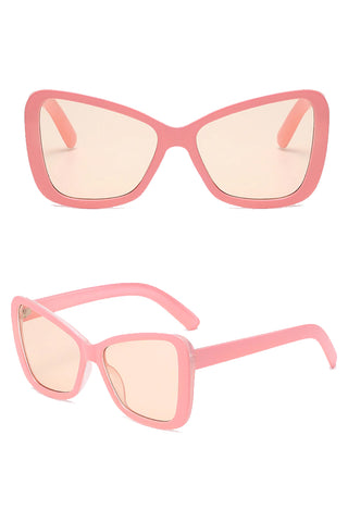 All eyes on you with this beautiful Atomic Pink Butterfly Retro Sunglasses. This pair of sunglasses features retro-inspired big square frames, gradient lens, and it's light on the nose.